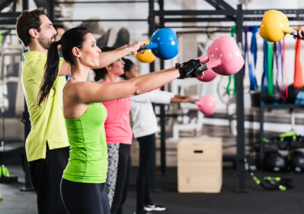 Functional fitness workout in sport gym with kettlebell